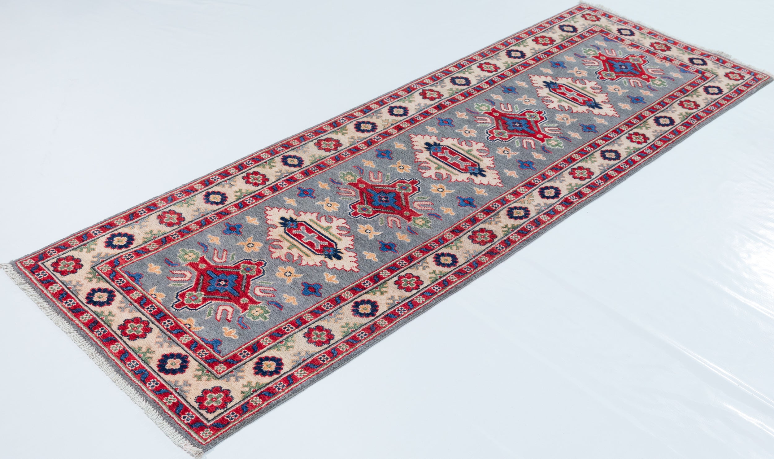 Full view at an angle of blue & ivory Kazak-inspired wool runner 29657.