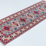 Full view at an angle of blue & ivory Kazak-inspired wool runner 29657.