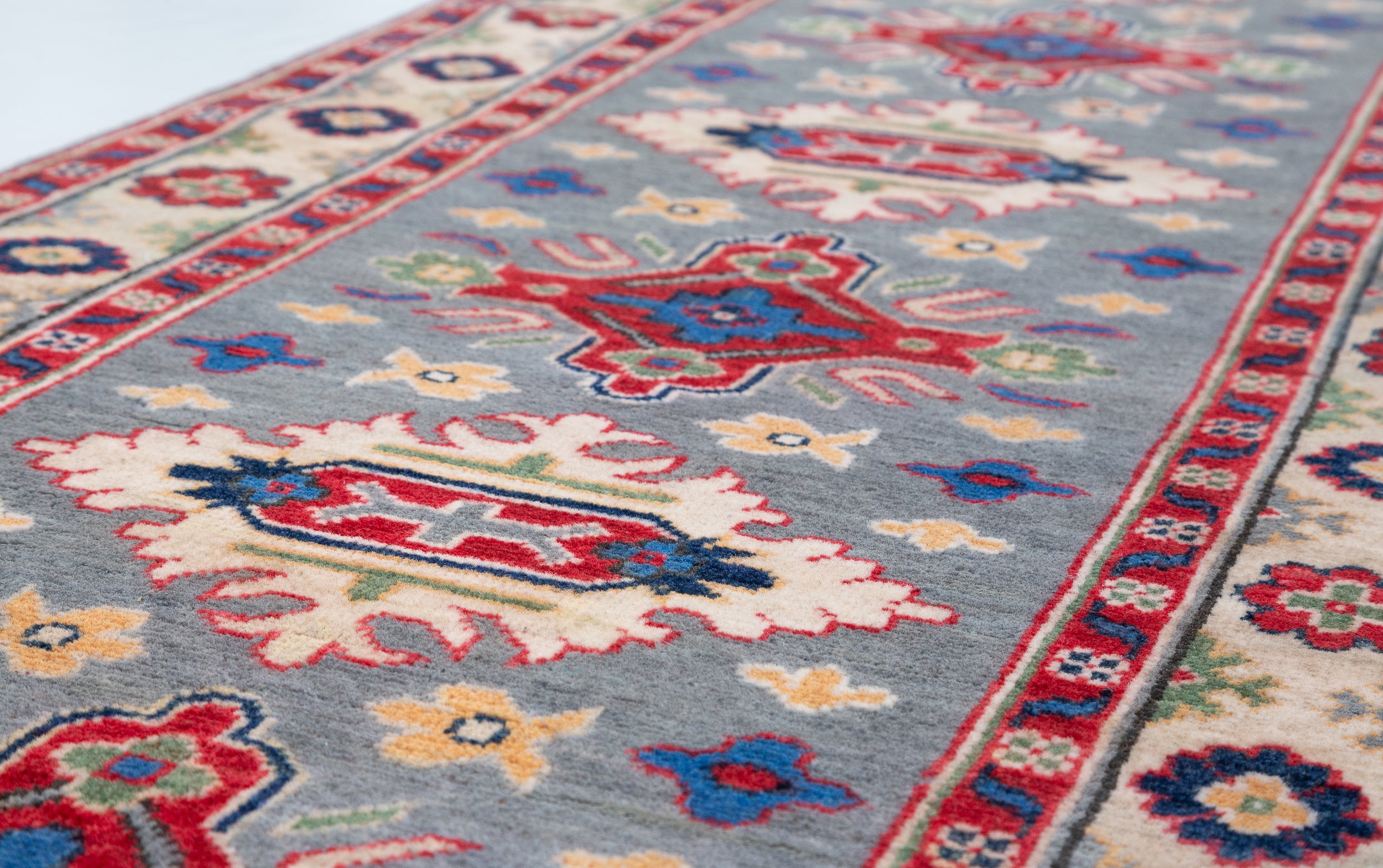 Pattern detail of blue & ivory Kazak-inspired wool runner 29657.