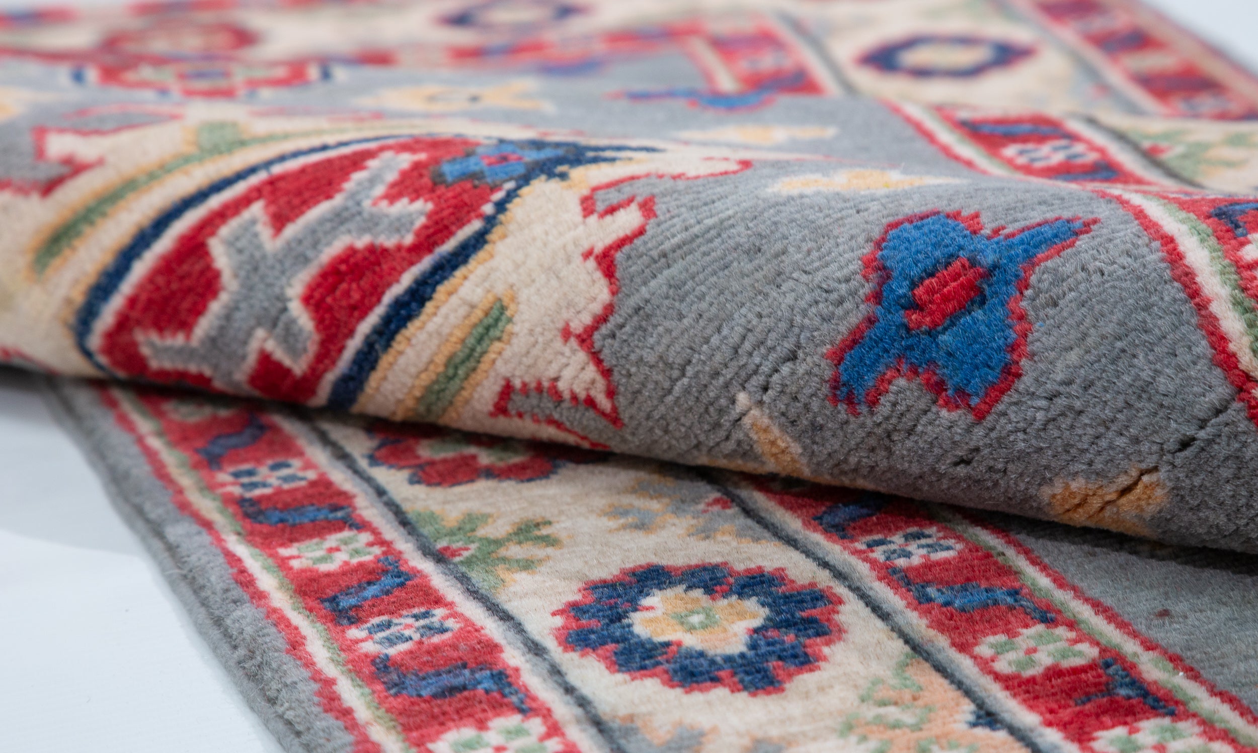 Folded edge and wool pile of blue & ivory Kazak-inspired wool runner 29657.