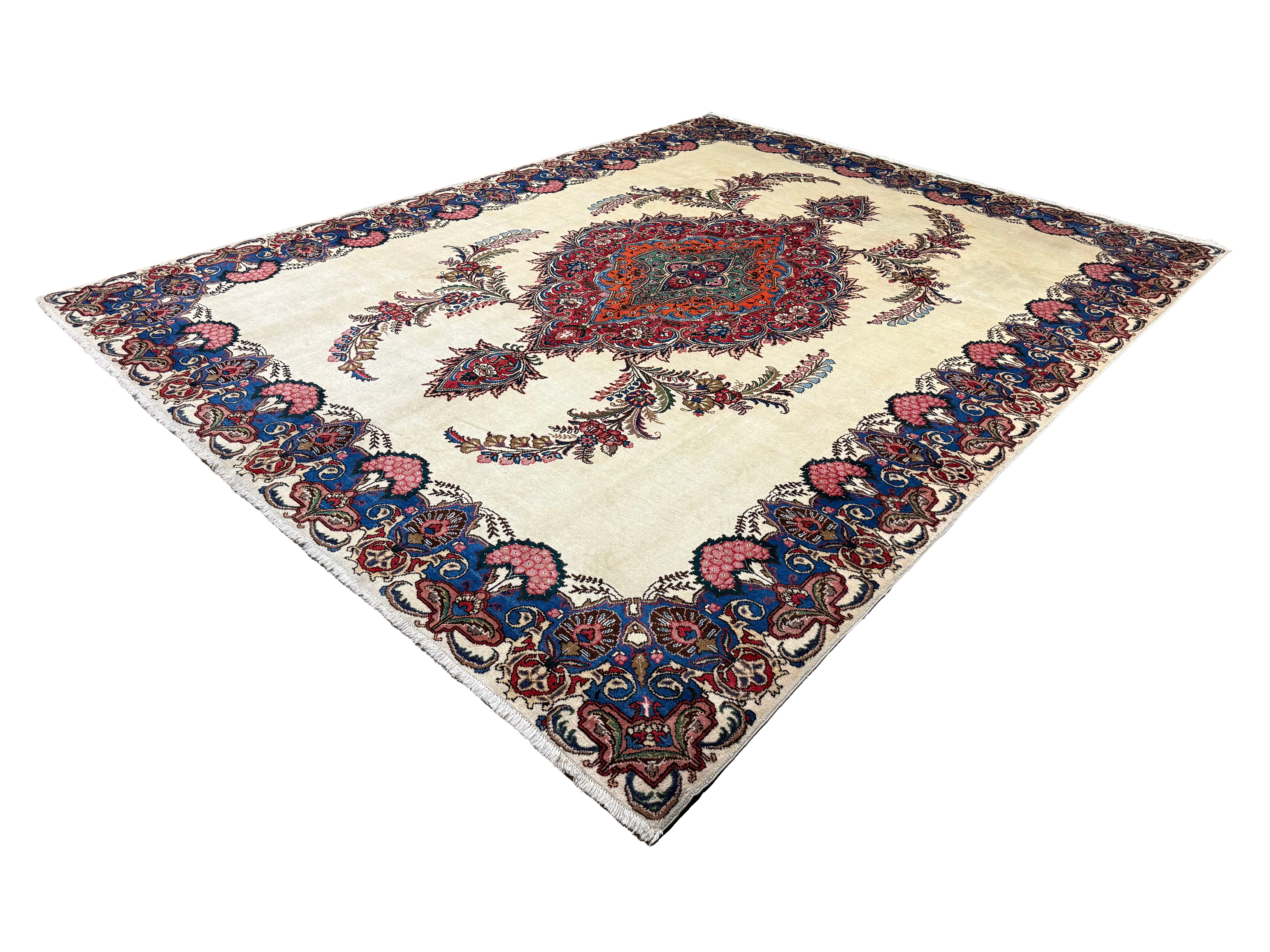 Vintage Tabriz Rug, angled view showing the full field and borders, hand-knotted wool pile. SKU 30228.