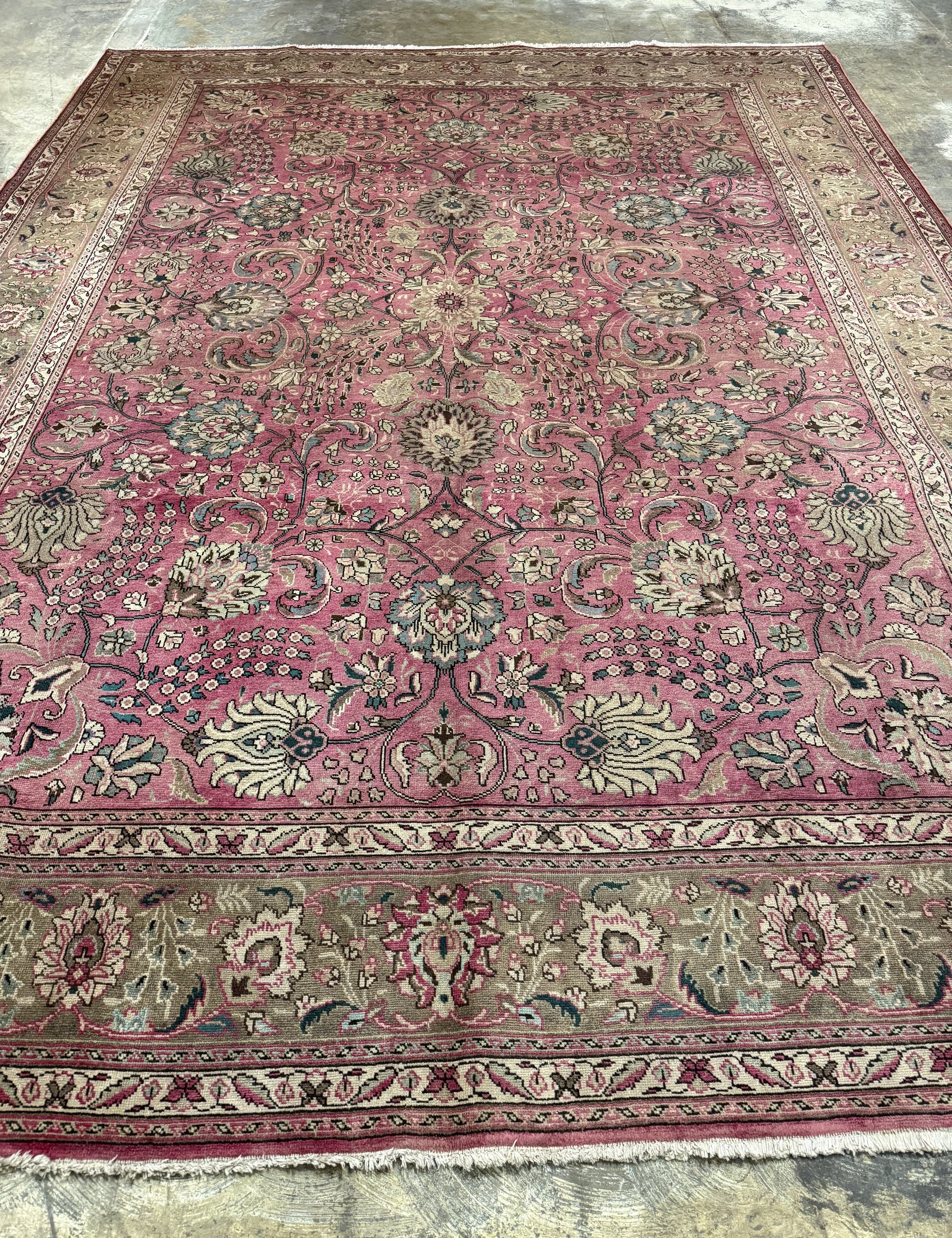 Persian Tabriz rug in dusty rose with ivory border and ornate medallion patterns