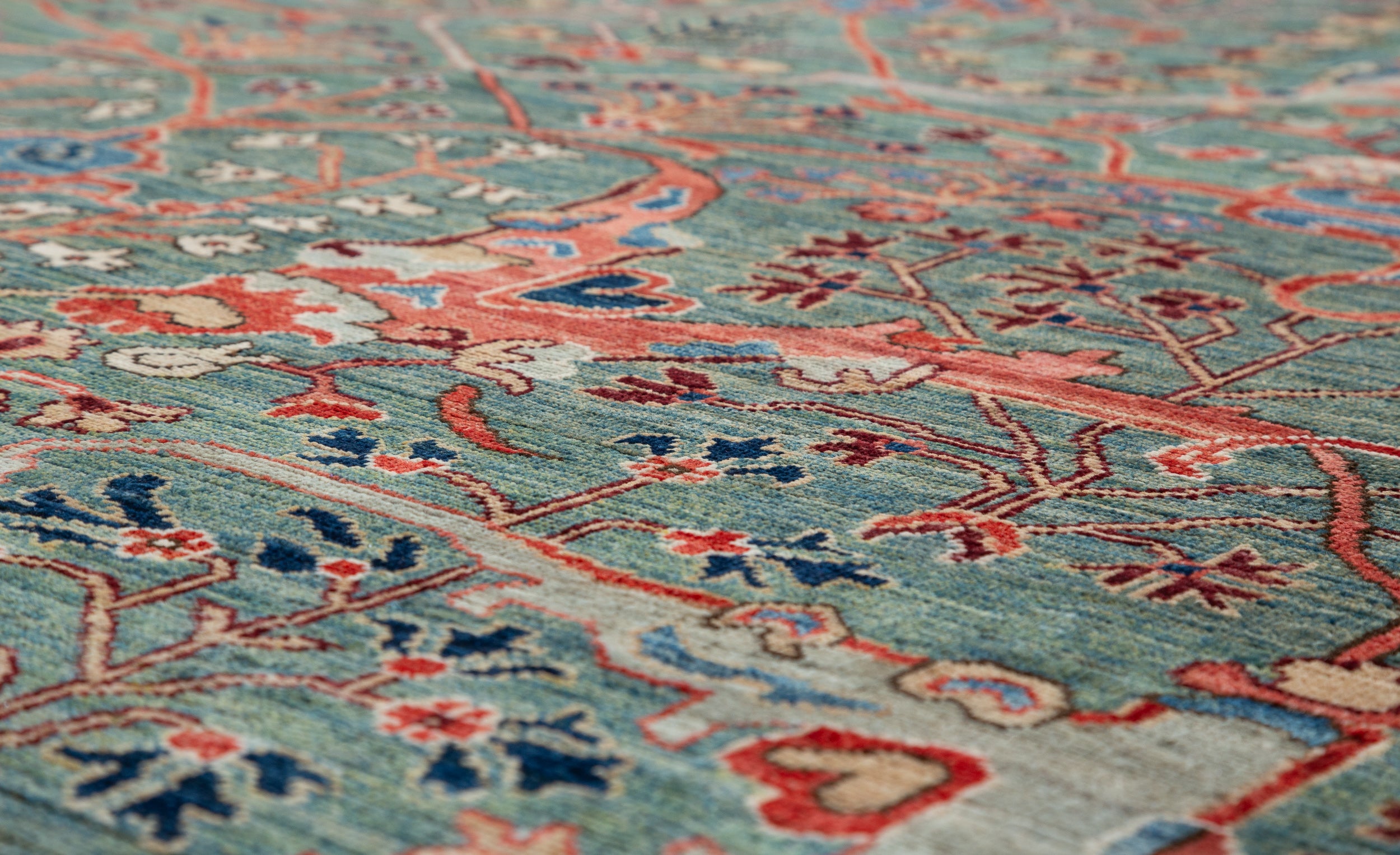 Afghan Chobbi Rug in muted green, rust and navy — pattern, texture or angled view