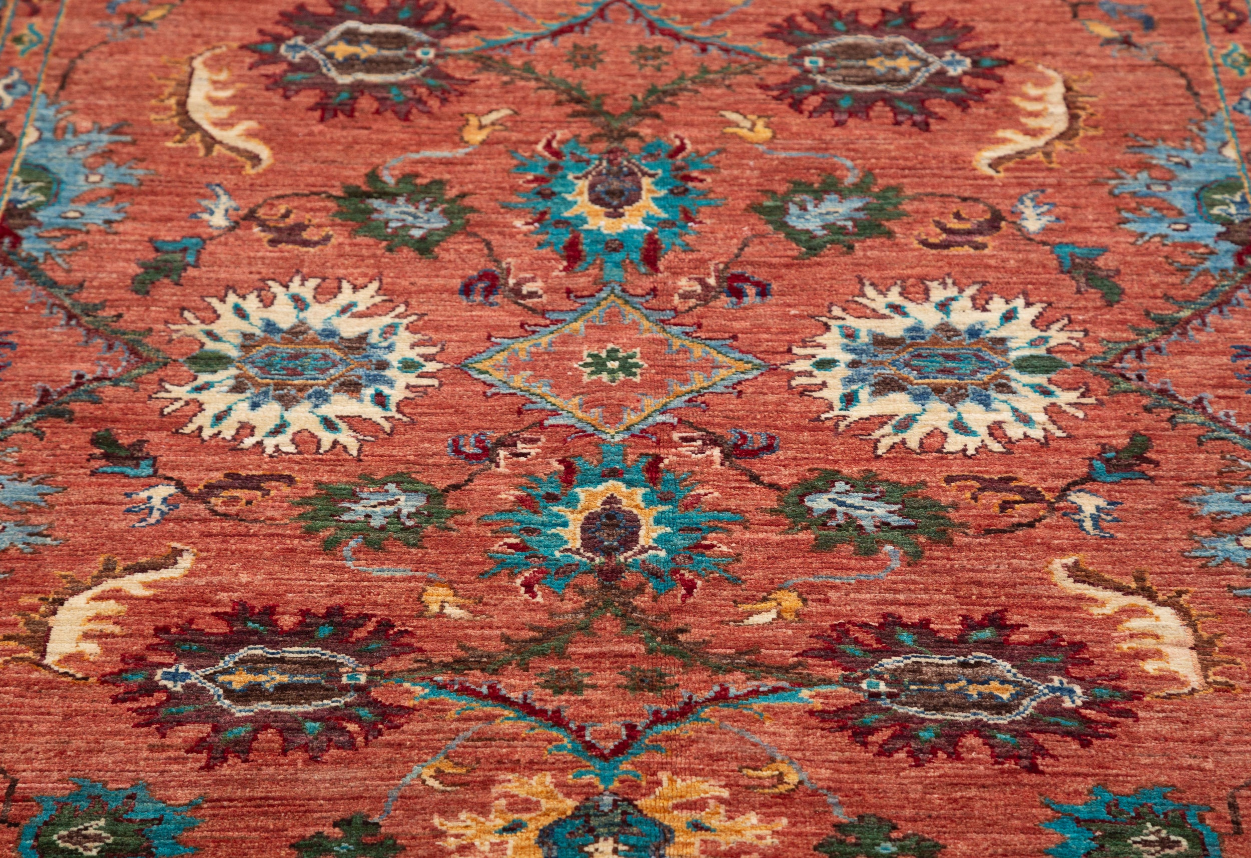 Afghan Sultani Rug in rust and teal — pattern, texture or angled view