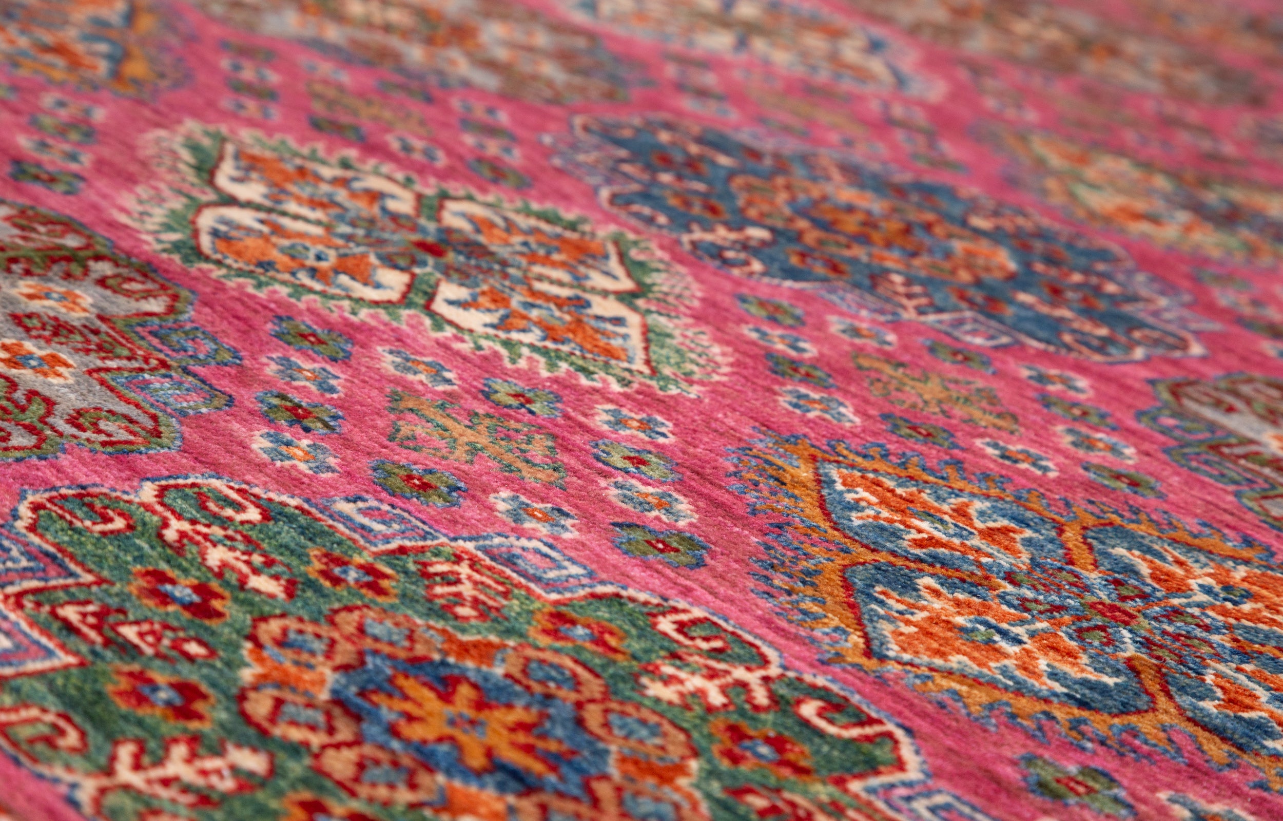 Afghan Super Kazak Rug in rose, navy and gold — pattern, texture or angled view