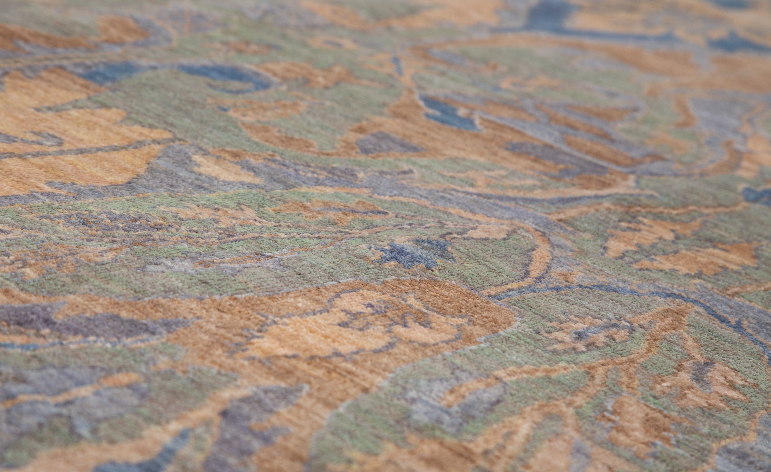 Chobbi Rug in muted blue and gold — pattern, texture or angled view