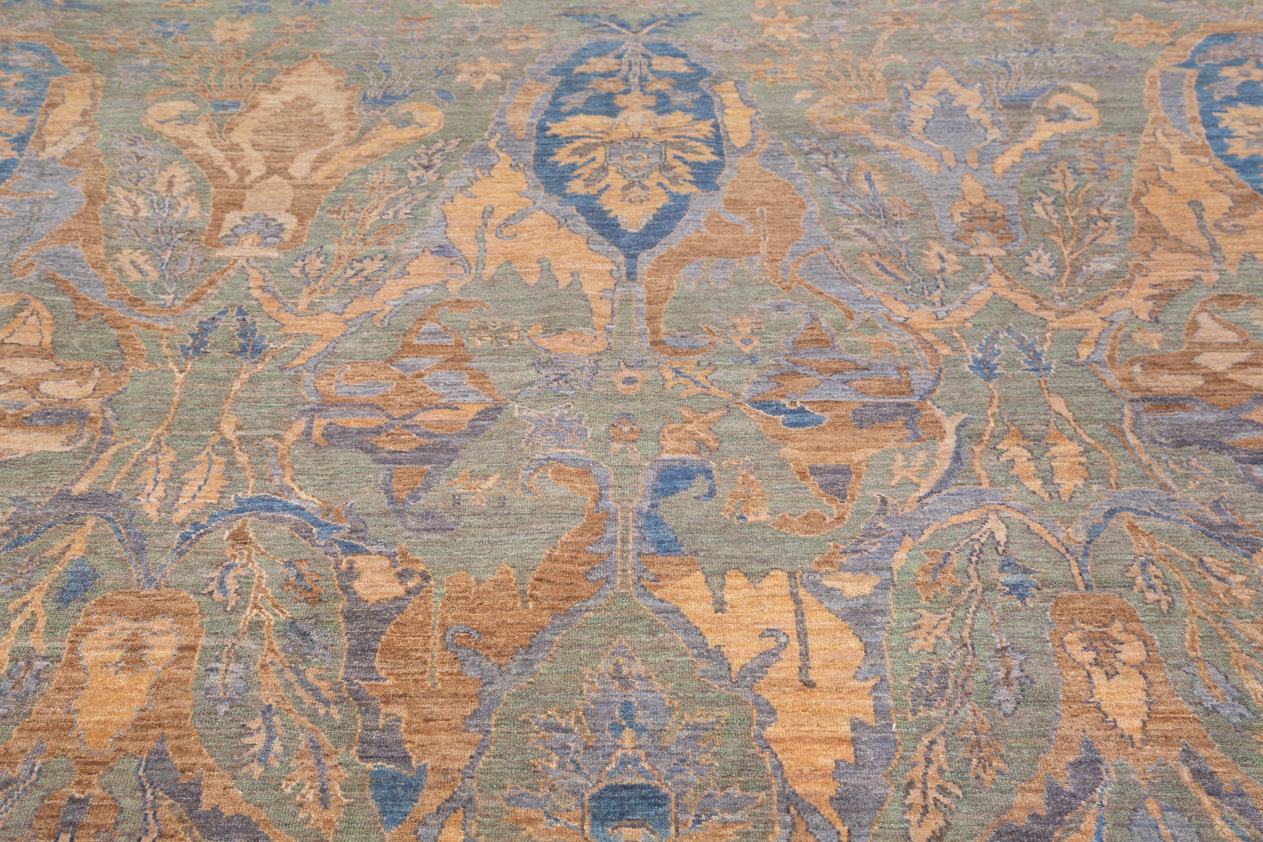 Chobbi Rug in muted blue and gold — pattern, texture or angled view