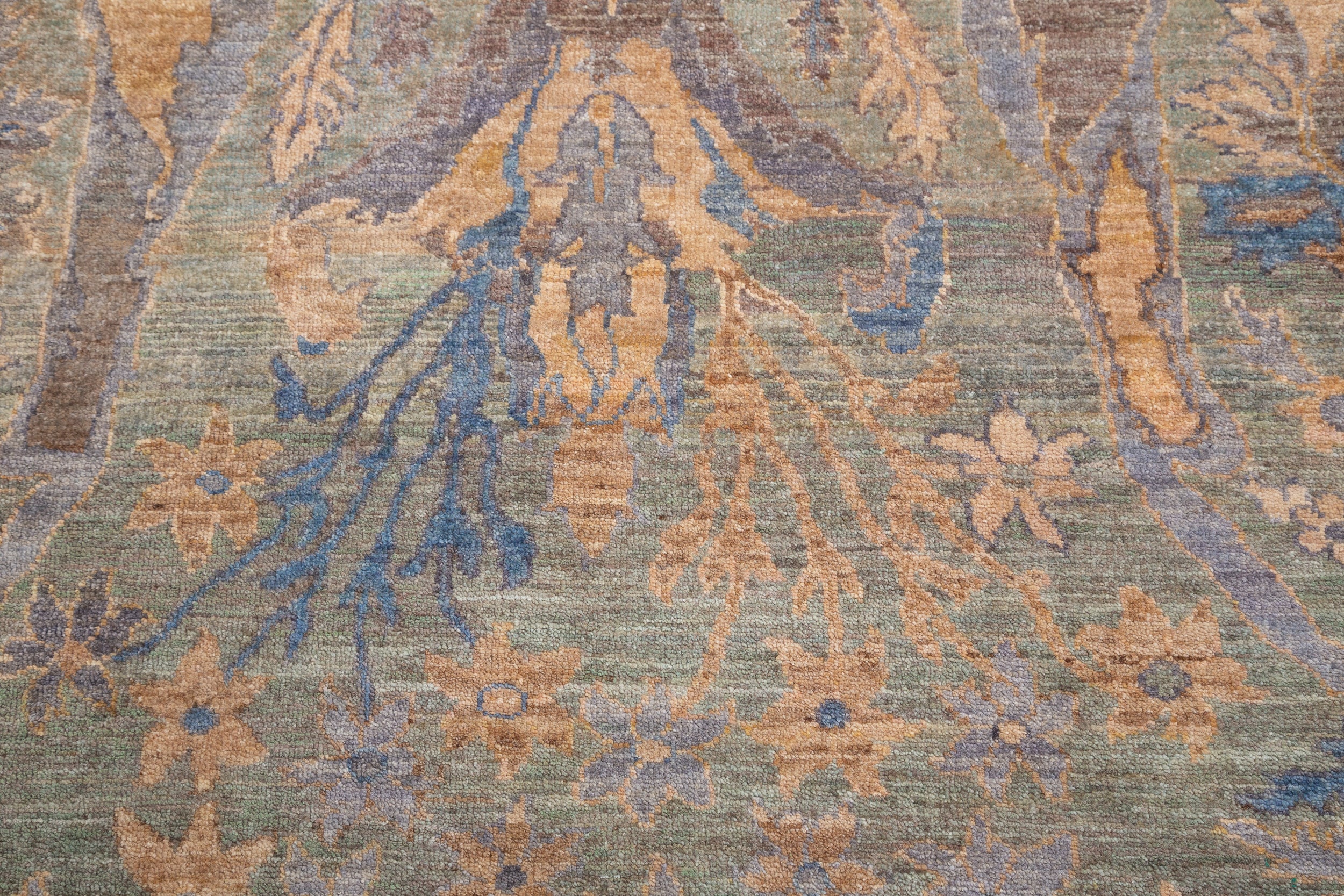 Chobbi Rug in muted blue and gold — pattern, texture or angled view