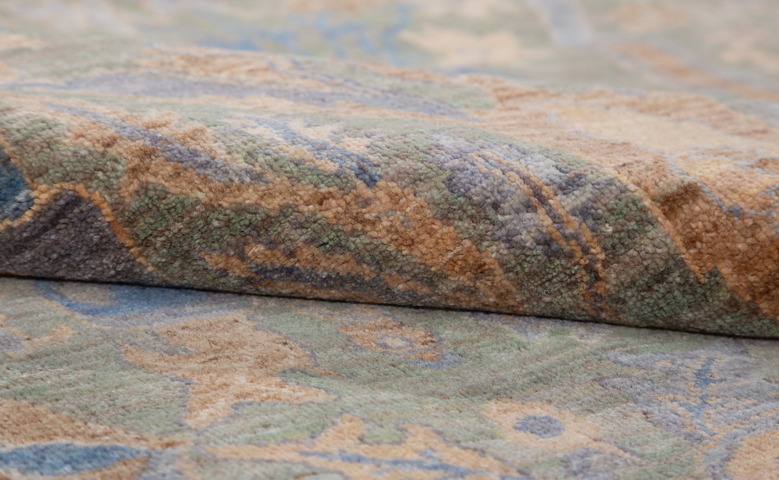 Chobbi Rug in muted blue and gold — pattern, texture or angled view