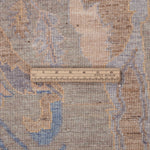 Chobbi Rug in muted blue and gold — pattern, texture or angled view