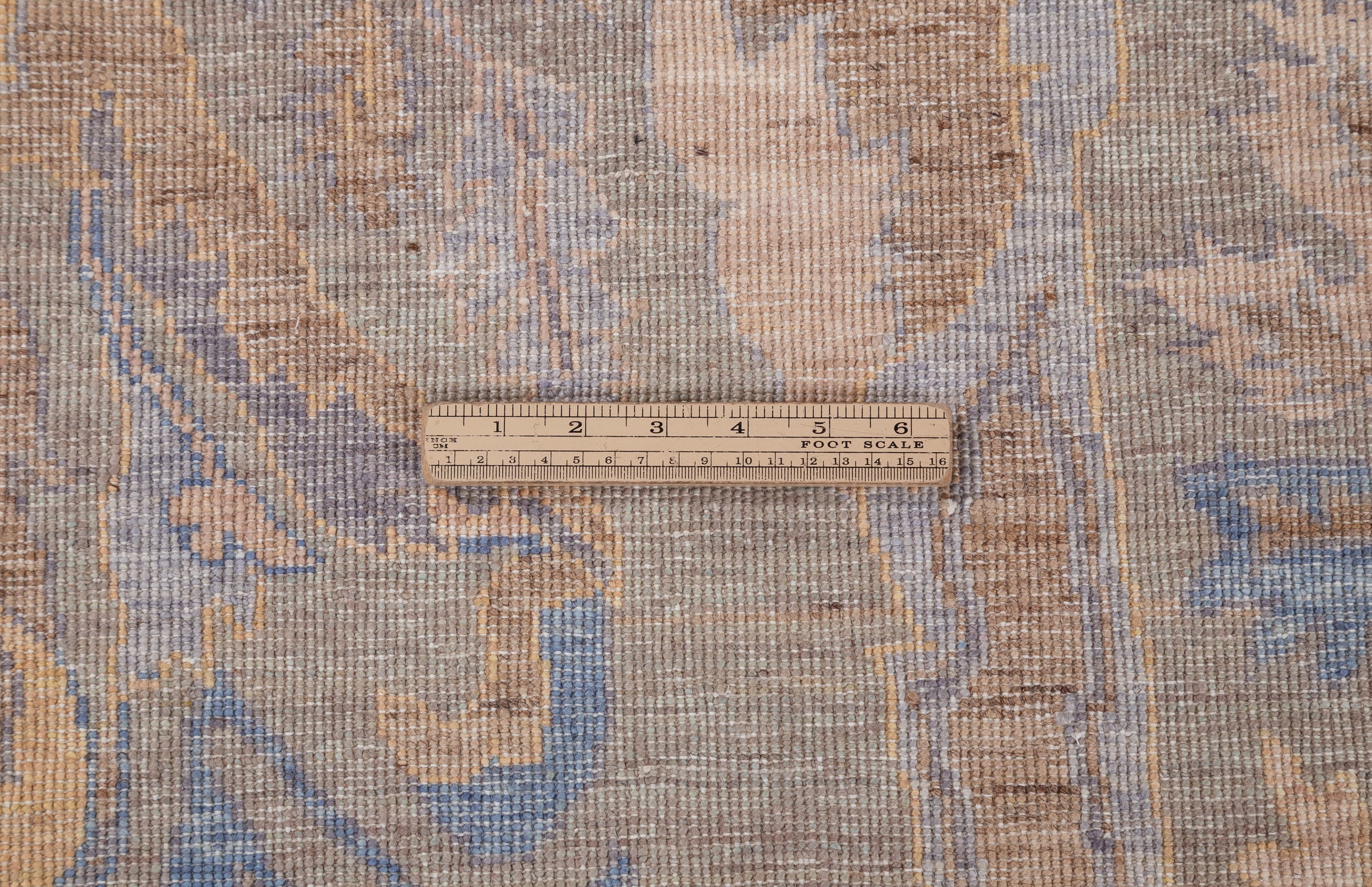 Chobbi Rug in muted blue and gold — pattern, texture or angled view