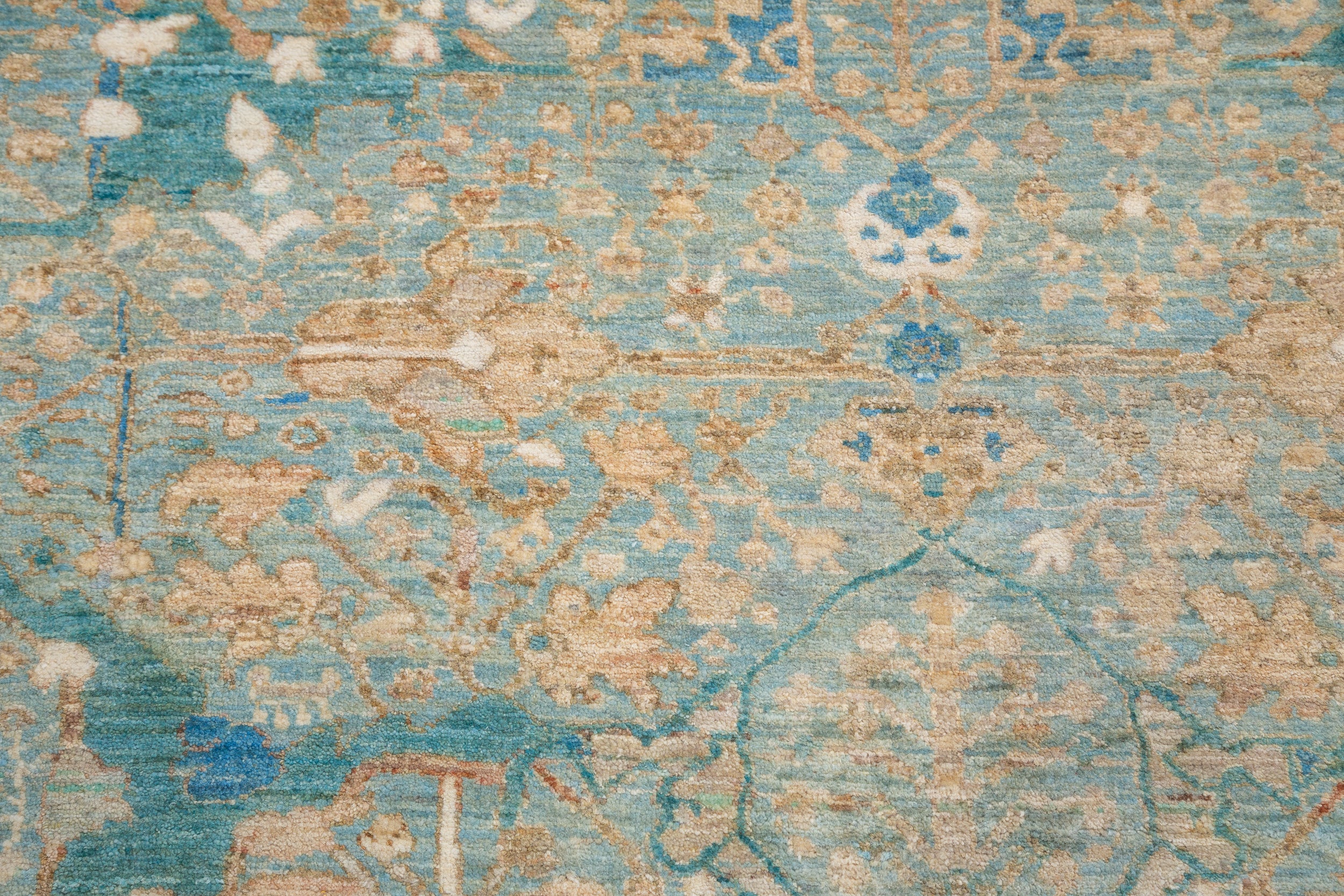 Chobbi Rug in pale turquoise and sand — pattern, texture or angled view