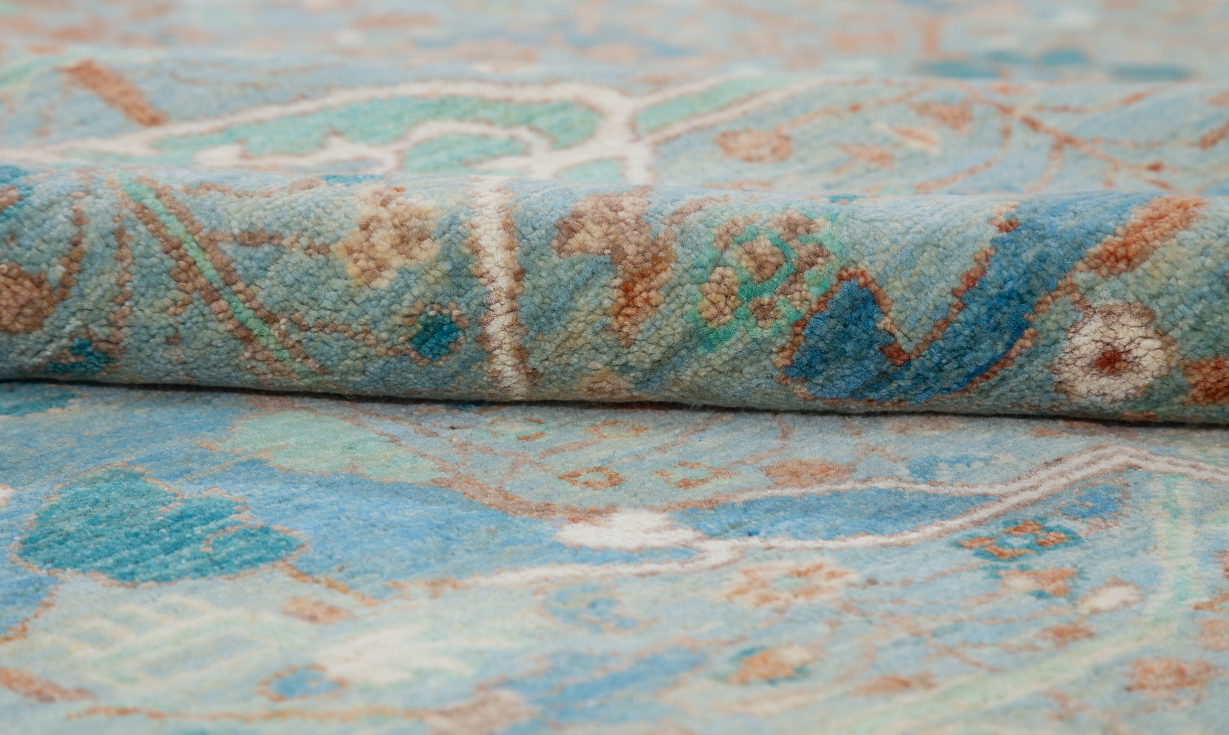 Chobbi Rug in pale turquoise and sand — pattern, texture or angled view