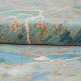 Chobbi Rug in pale turquoise and sand — pattern, texture or angled view