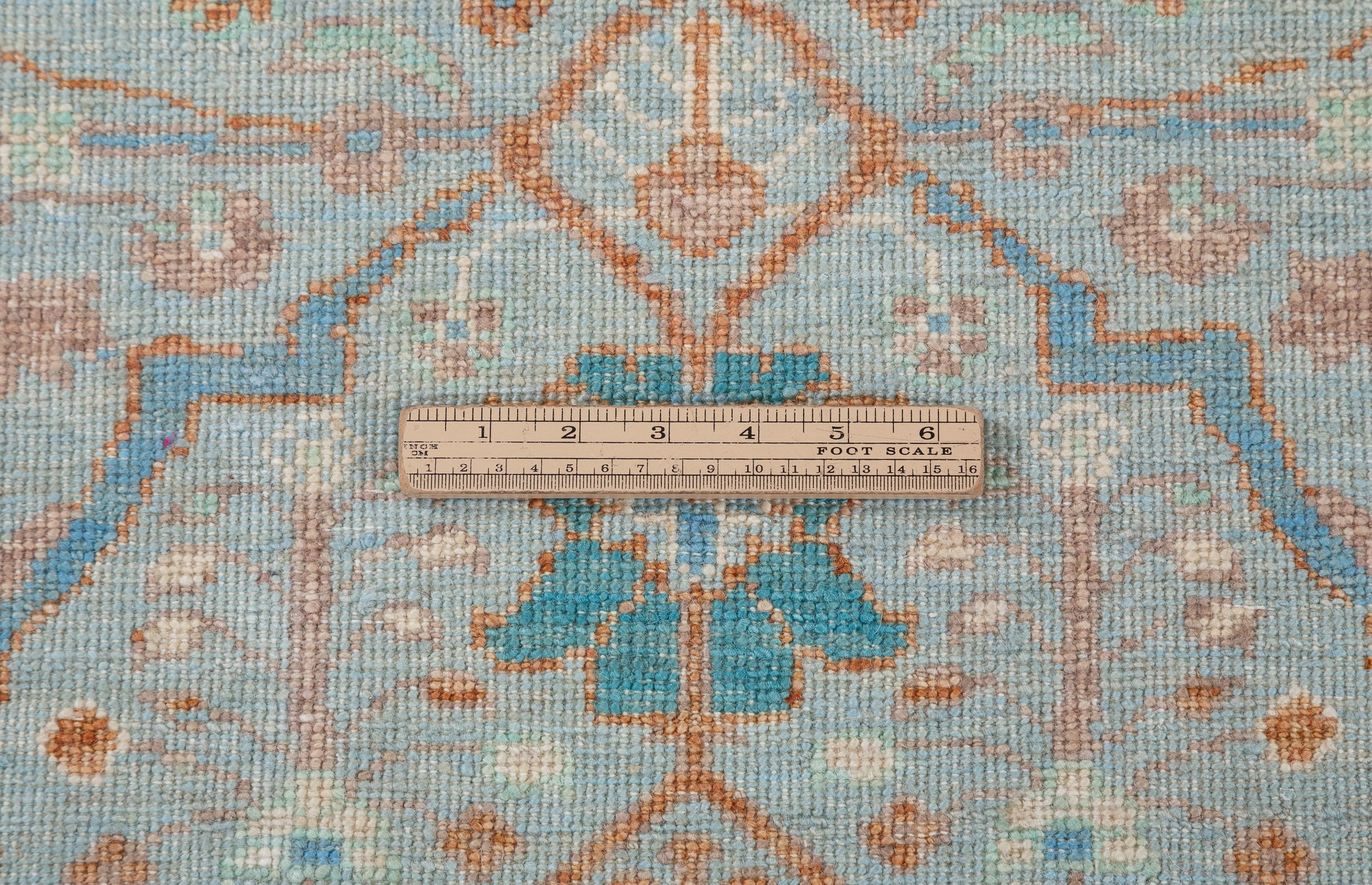 Chobbi Rug in pale turquoise and sand — pattern, texture or angled view
