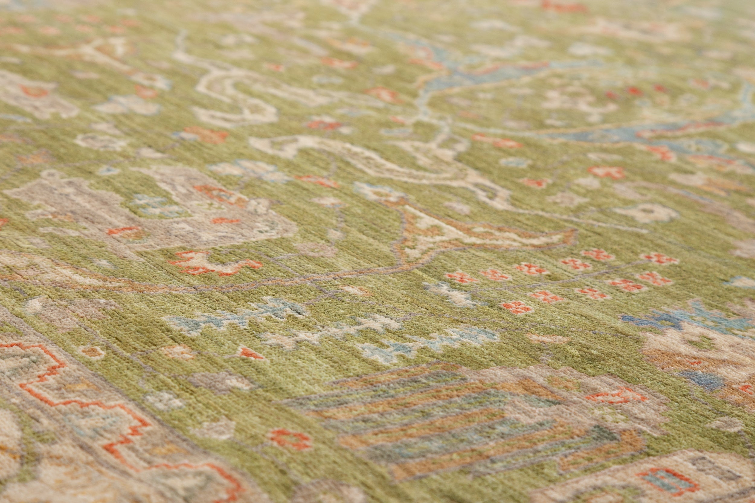 Chobbi Rug in olive green and cream — pattern, texture or angled view