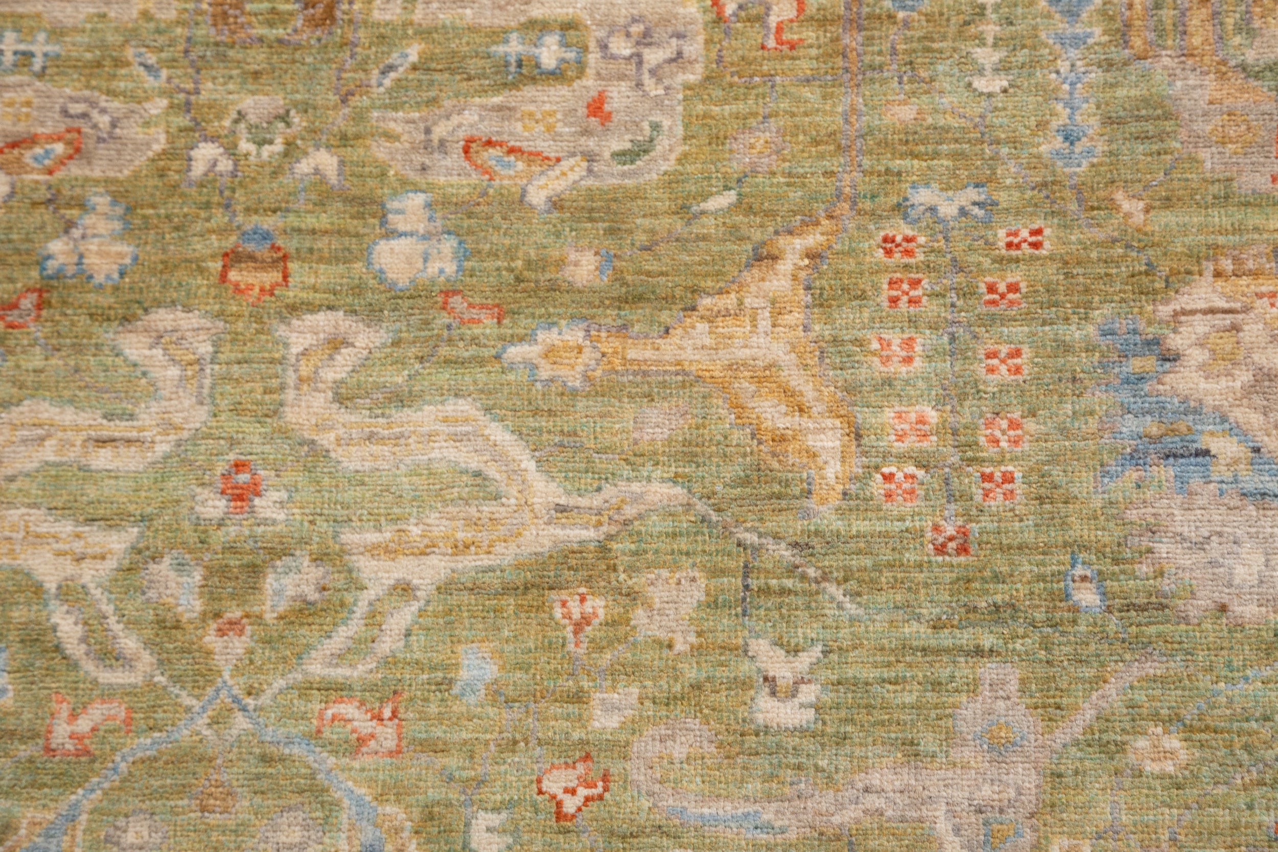 Chobbi Rug in olive green and cream — pattern, texture or angled view