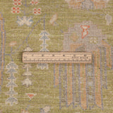 Chobbi Rug in olive green and cream — pattern, texture or angled view