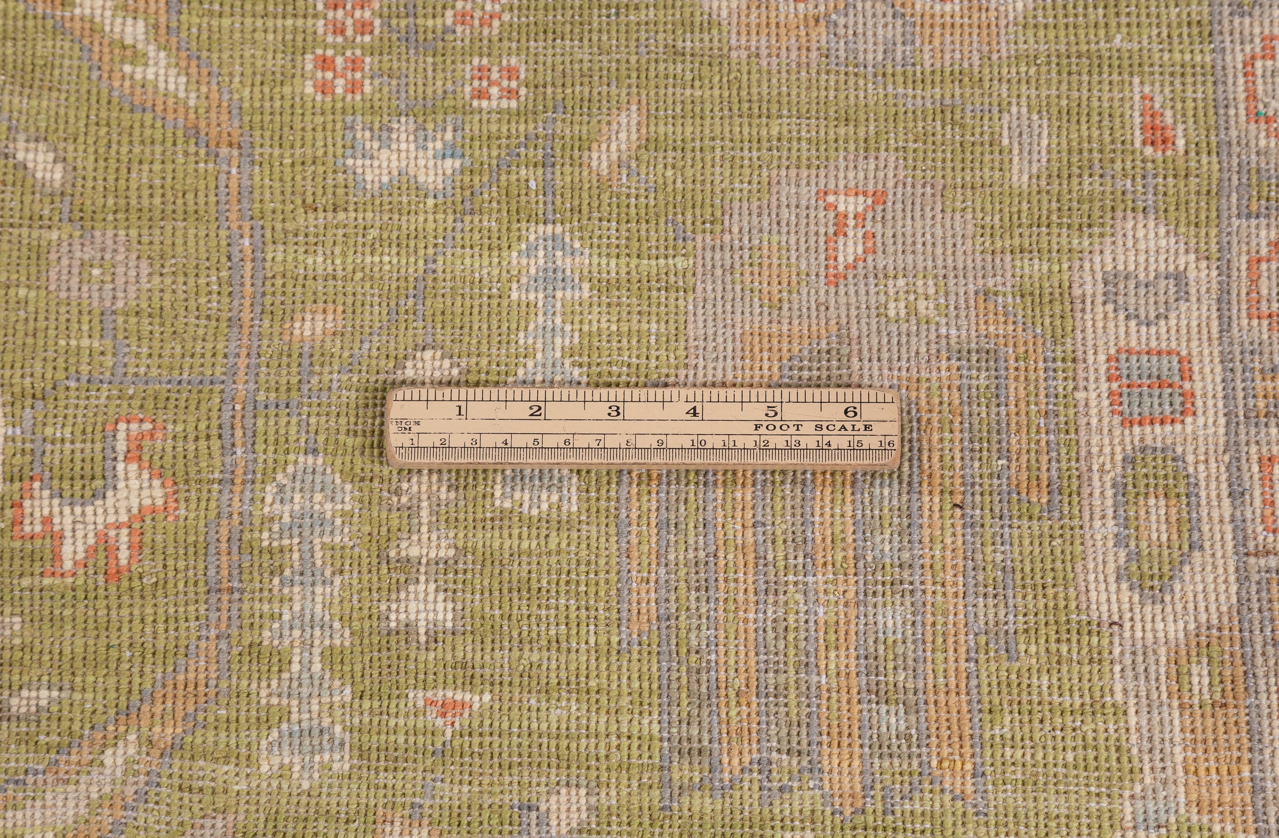 Chobbi Rug in olive green and cream — pattern, texture or angled view