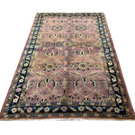 Vintage Sarouk Rug, full rug in perspective showing the patterned field and borders, hand-knotted wool pile. SKU EE 1.0236.