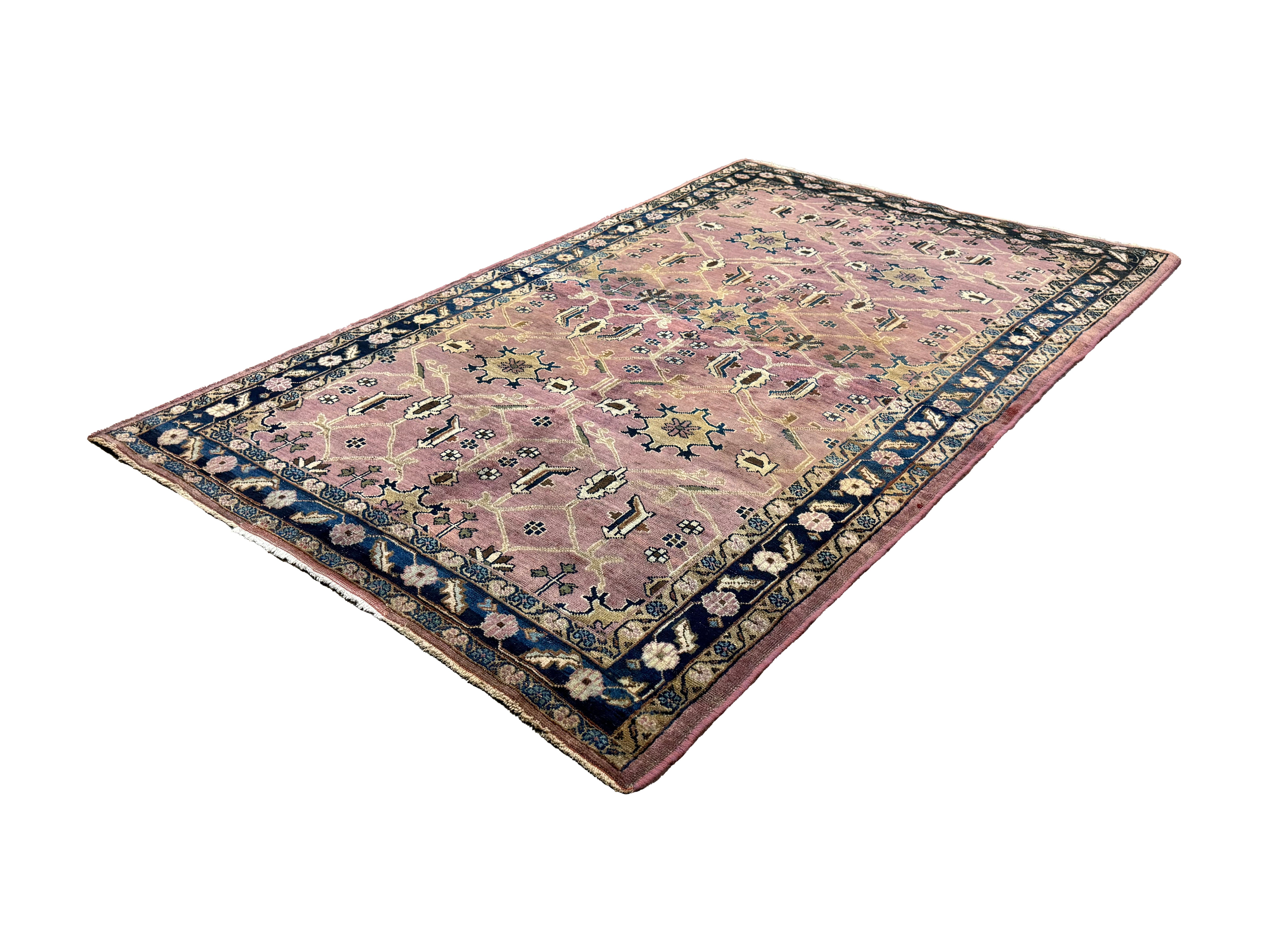 Vintage Sarouk Rug, angled view showing the full field and borders, hand-knotted wool pile. SKU EE 1.0236.