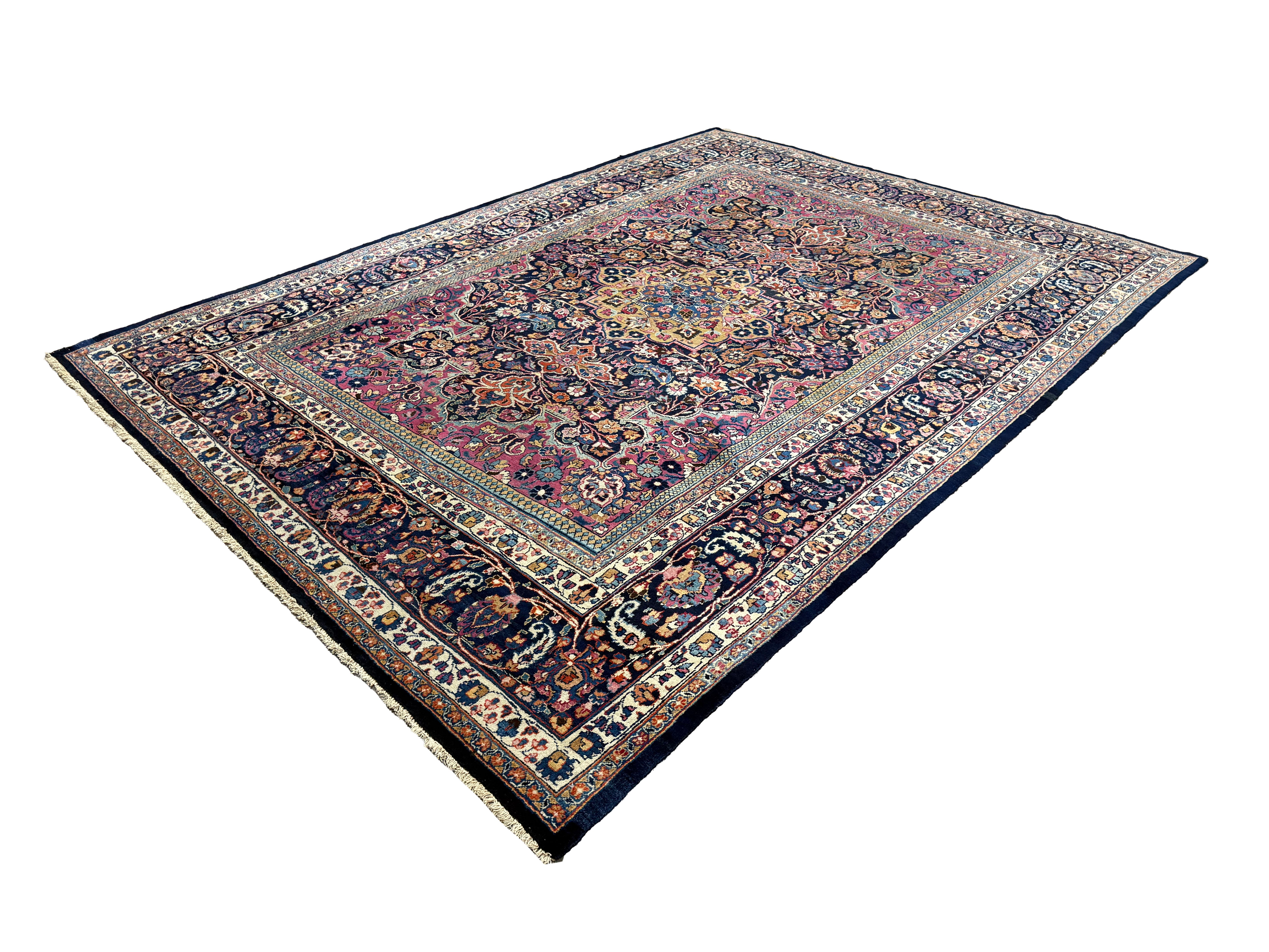 Vintage Mashhad Rug, diagonal perspective view of the complete rug, hand-knotted wool pile. SKU EE 1.0651.