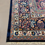 Vintage Mashhad Rug, close-up of the patterned corner and edge, hand-knotted wool pile. SKU EE 1.0651.