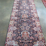 Fine Persian Kirman runner rug with navy, red, and cream medallion pattern