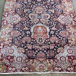 Fine Persian Kirman runner rug front view with navy field and ornate central medallion