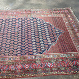 Persian Malayer rug corner detail with navy field and red border with motifs