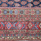 Malayer rug border with red-blue diamonds and cream decorative stripes