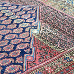 Malayer rug corner with blue field and red patterned border