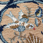 Persian Kashan rug close-up of tan and blue floral pattern with textured pile
