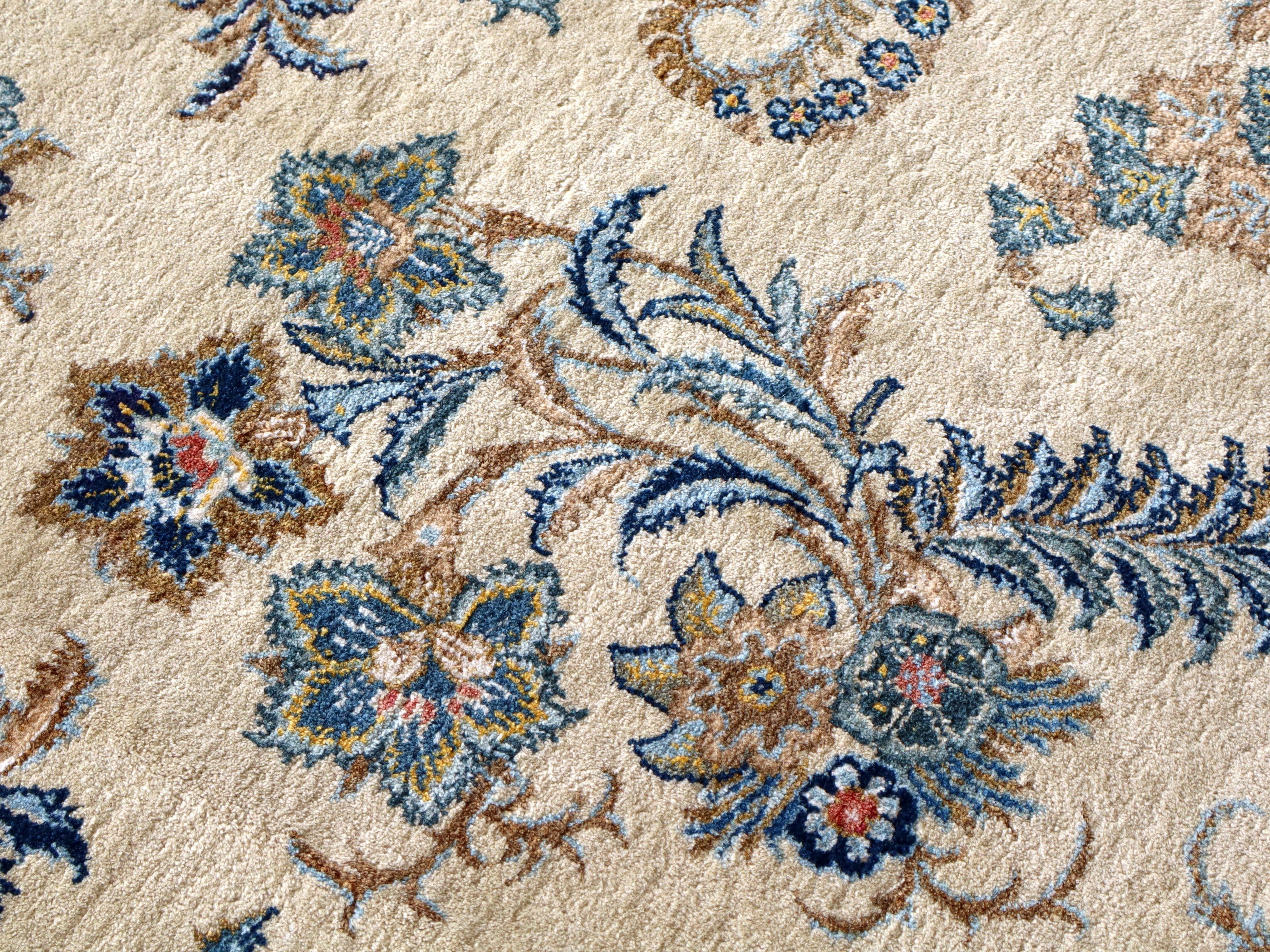 Persian Kashan rug all-over floral and leaf design on cream with blue and gold tones
