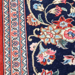 Navy Persian runner rug close-up floral vines and red accent details