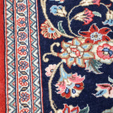Navy Persian runner rug close-up floral vines and red accent details