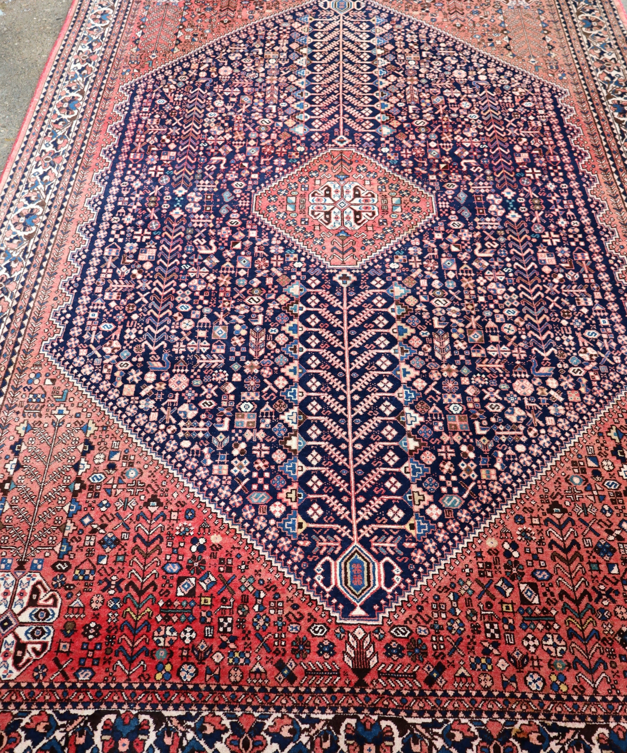 Persian Abadeh rug with symmetrical navy center stripe and red corner motifs