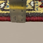Vintage Bakhshayesh Rug, side-on pile and edge detail with a ruler, hand-knotted wool pile. SKU NH 142844.