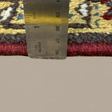 Vintage Bakhshayesh Rug, side-on pile and edge detail with a ruler, hand-knotted wool pile. SKU NH 142844.