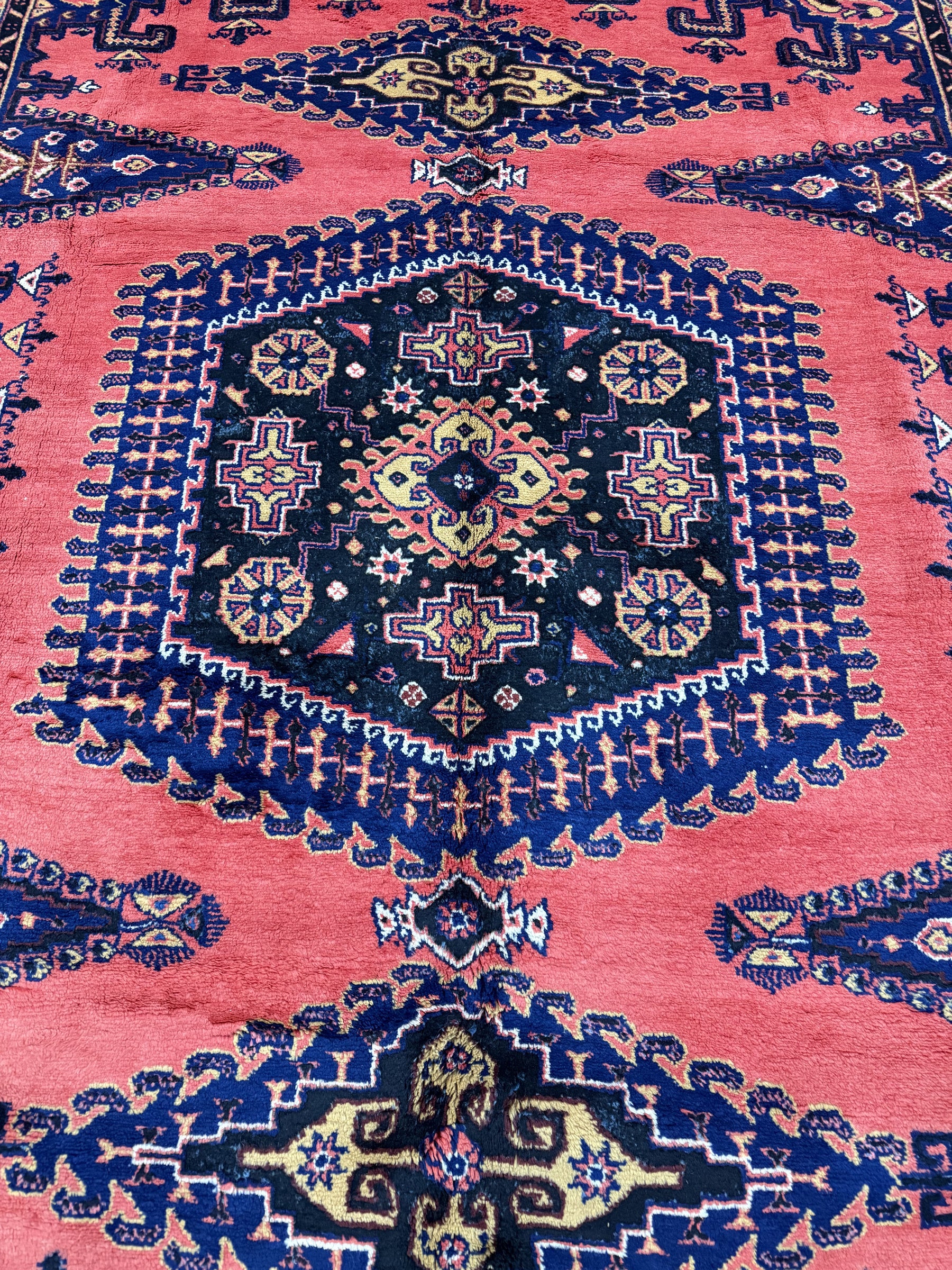 Persian Vise rug 7'2"x9'6", close-up of central dark navy medallion on red