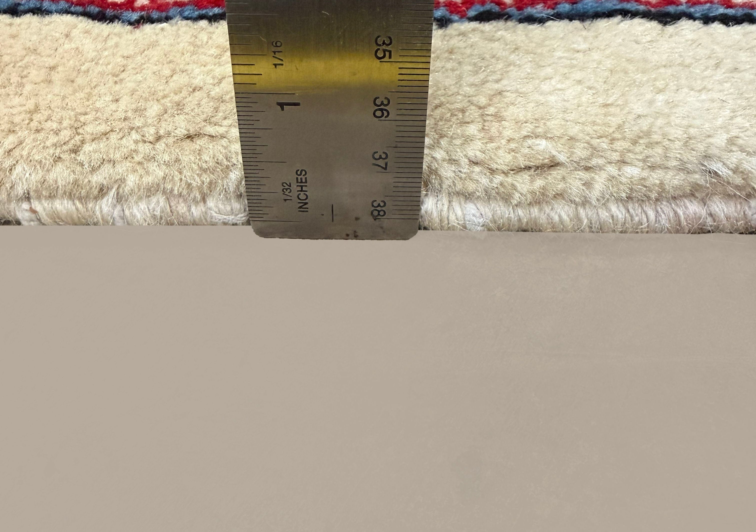 Vintage Arak Boteh Mir Rug, side-on pile and edge detail with a ruler, hand-knotted wool pile. SKU PP 100232.