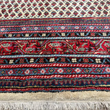 Vintage Arak Boteh Mir Rug, close-up of the border and fringe, hand-knotted wool pile. SKU PP 100232.