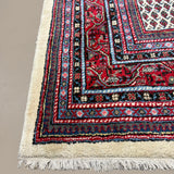Vintage Arak Boteh Mir Rug, close-up of the patterned corner and edge, hand-knotted wool pile. SKU PP 100232.