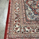 Persian Mahal rug corner with red border, cream medallion and blue vine details