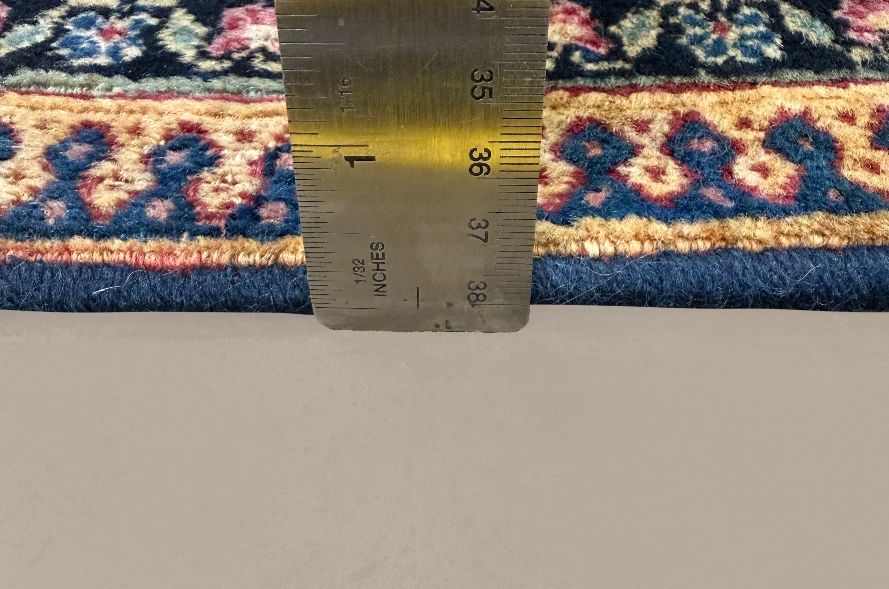 Vintage Mashhad Khorasan Rug, side-on pile and edge detail with a ruler, hand-knotted wool pile. SKU RR 30636.