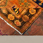 Persian Luri Rug, folded corner and reverse, hand-knotted wool with orange colouring. SKU RR 32364.