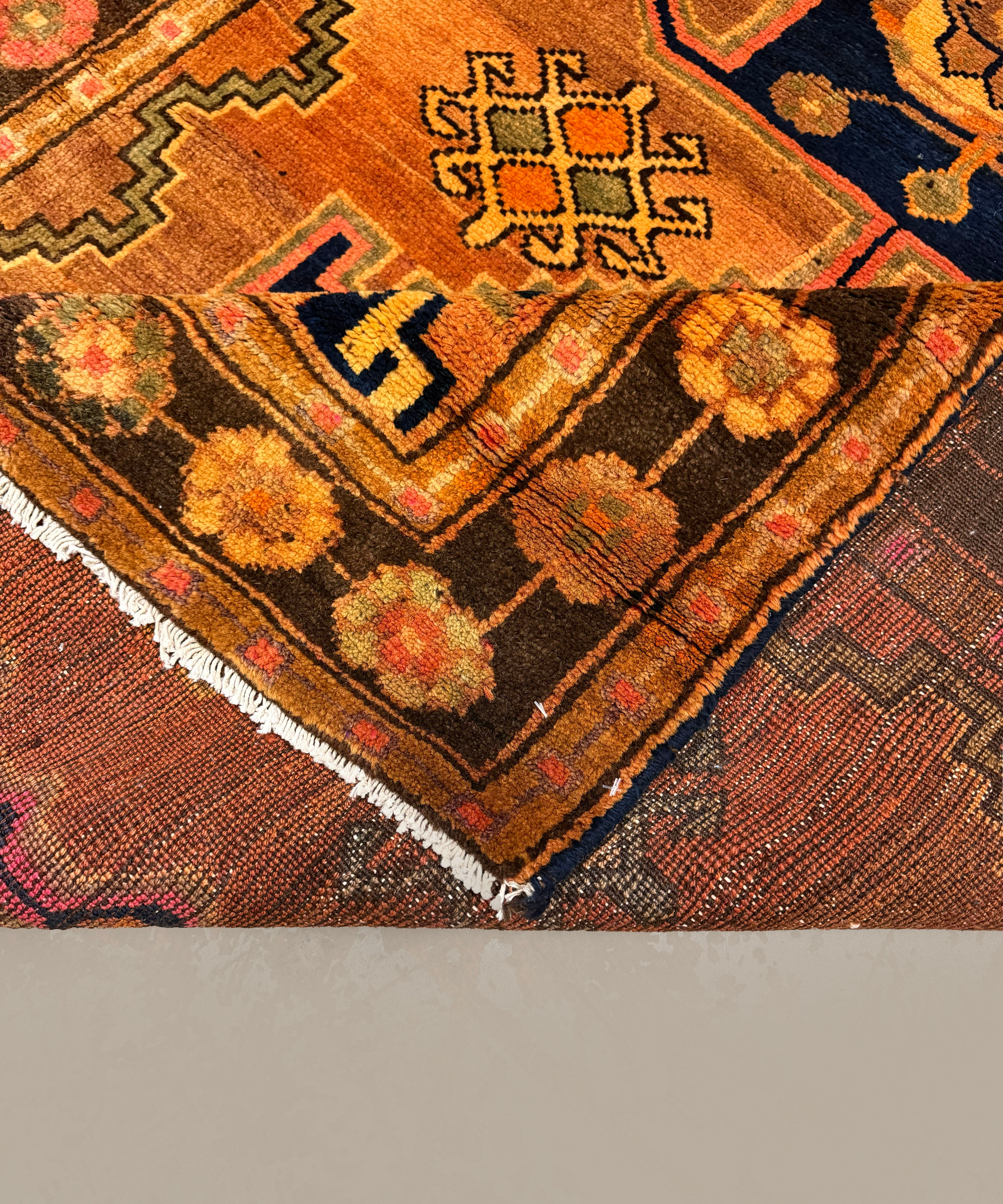 Persian Luri Rug, folded corner and reverse, hand-knotted wool with orange colouring. SKU RR 32364.