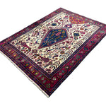 Vintage Sirjan Luri Afshar Rug, angled view showing the full field and borders, hand-knotted wool pile. SKU RR 32447.