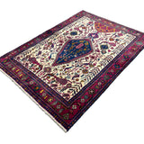 Vintage Sirjan Luri Afshar Rug, angled view showing the full field and borders, hand-knotted wool pile. SKU RR 32447.