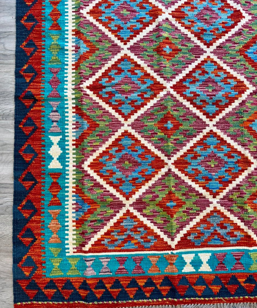 Afghan Chobi kilim rug with blue and red border and multicolor diamond pattern